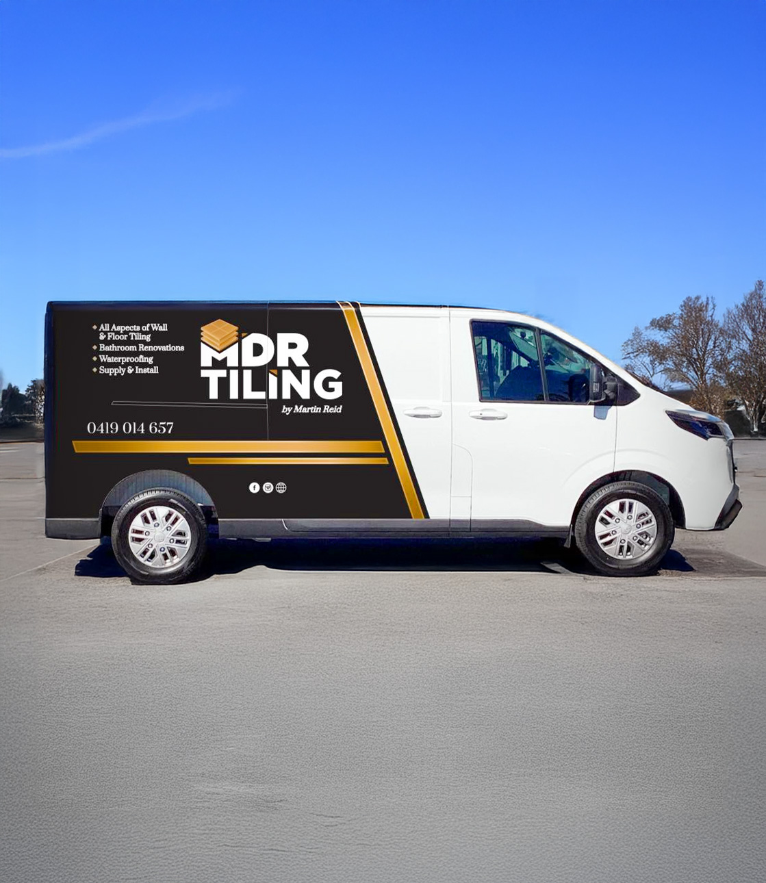 A white service "MDR TILING by Martin Reid" van parked on asphalt under a clear blue sky.